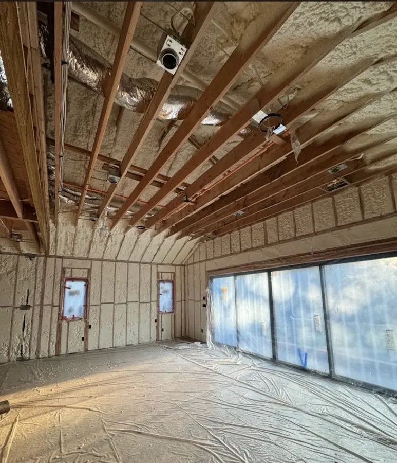 Interior walls and ceiling insulated with spray foam during new construction in Kewanee